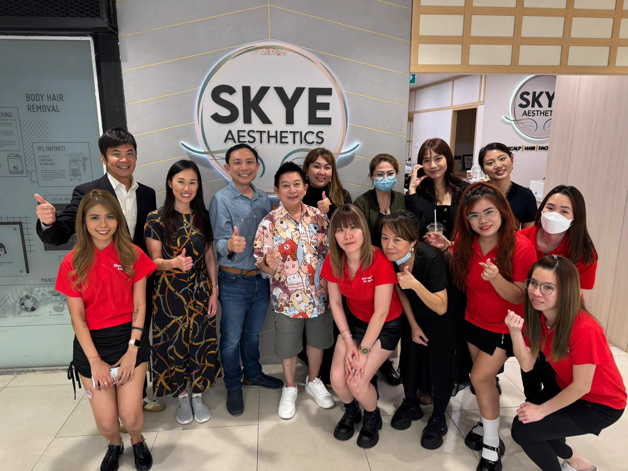 Skye Aesthetics team and founders in front of Plaza Singapura studio